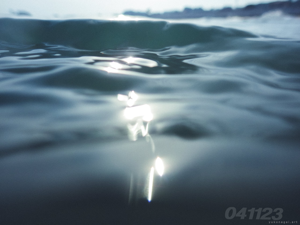 Sea surface with sunlight reflections.