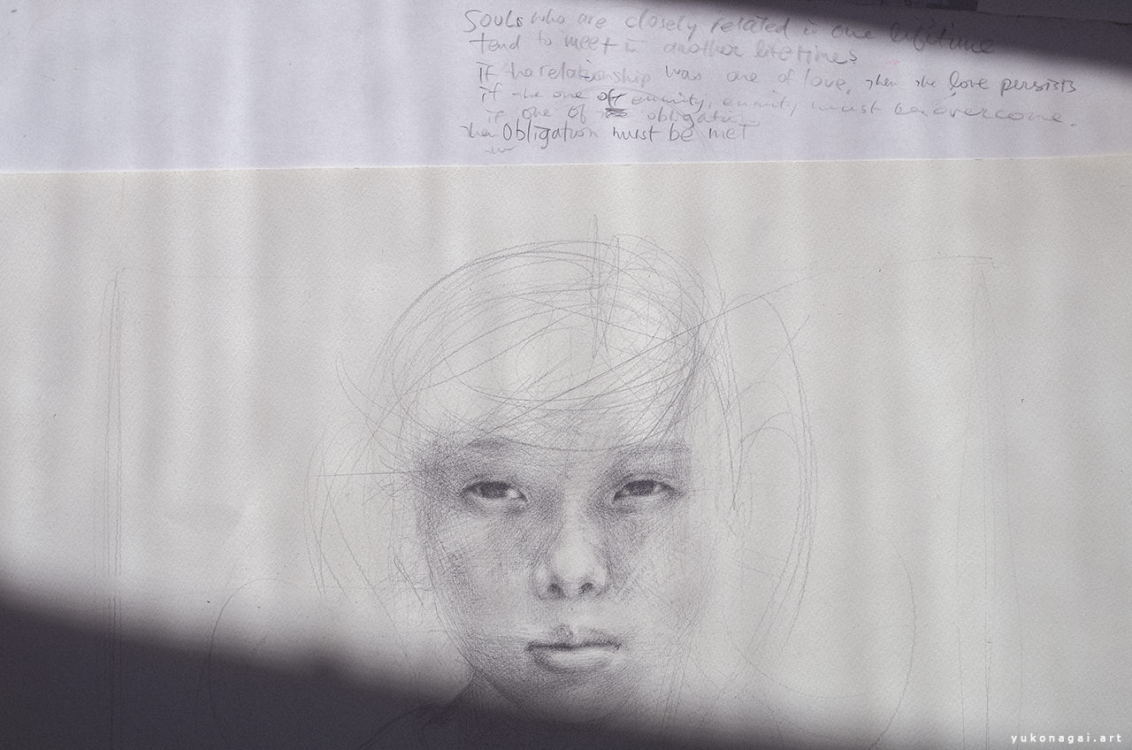 Face of a child drawn by pencil in progress, with a quote.