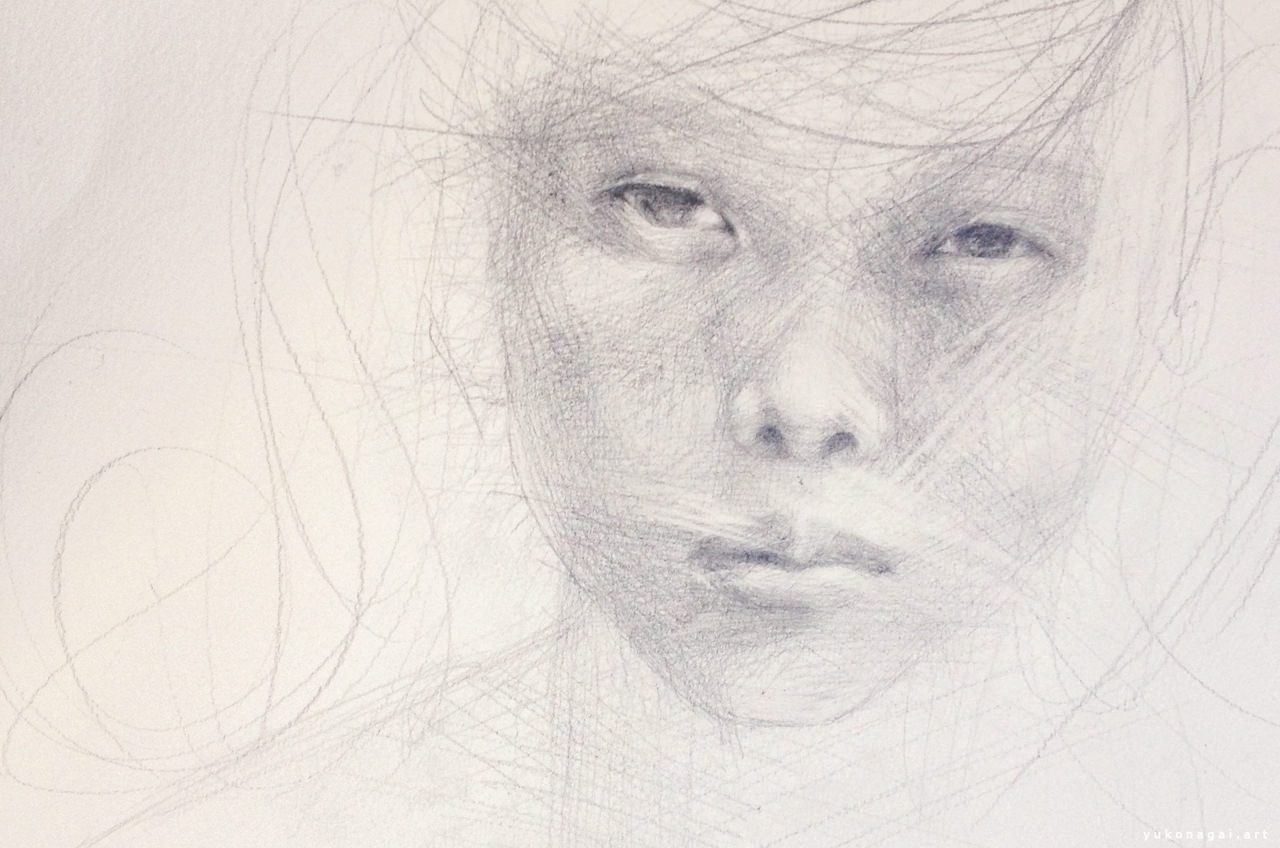 Face of a child drawn by pencil in progress.