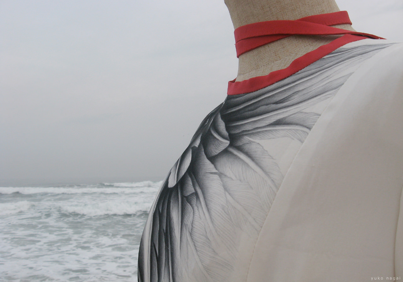 A hand painted dress at the shore.
