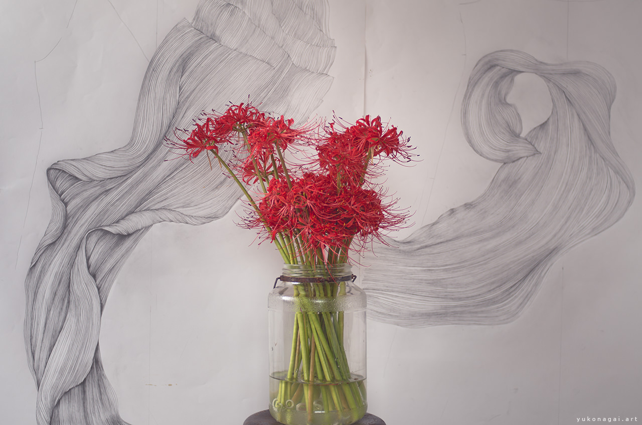A spider lily bouquet and abstract line drawings.
