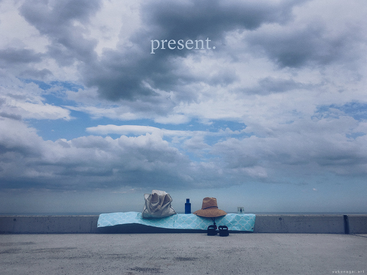 Blue sky with floating clouds and picnic luggage.