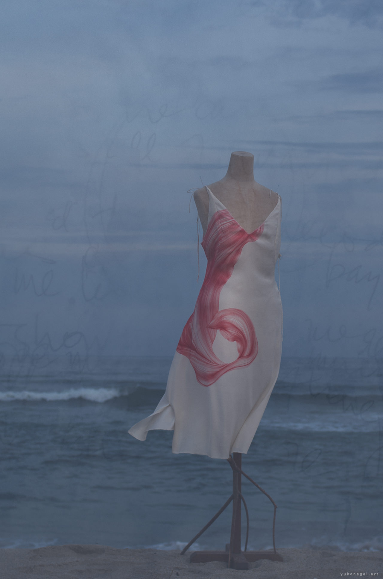 A dress with abstract line drawing of a flower petal on the beach, layered with handwritten letters.